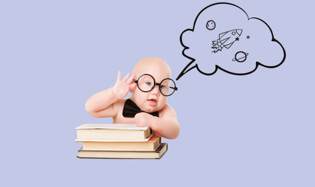 Baby with glasses reading